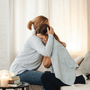 mother and daughter embracing